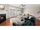 Cozy living room with fireplace, hardwood floors, comfortable seating, and a view of the backyard at 2519 Rutherford Way, Charleston, SC 29414