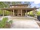 Community pool house featuring a brick fireplace, picnic tables and a covered structure at 2519 Rutherford Way, Charleston, SC 29414