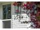 Close-up of the address number on a white brick home, complemented by modern lighting and greenery at 3 Lauden Blvd, Isle of Palms, SC 29451
