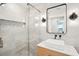 Modern bathroom with glass enclosed shower, marble tiling, and vessel sink at 3 Lauden Blvd, Isle of Palms, SC 29451