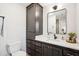 Well-appointed bathroom featuring modern vanity with marble countertop, black hardware, and additional storage at 3 Lauden Blvd, Isle of Palms, SC 29451