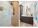 Elegant bathroom showcasing a glass enclosed shower and stylish vanity with black fixtures and ample storage at 3 Lauden Blvd, Isle of Palms, SC 29451
