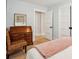 Comfortable bedroom featuring a charming wooden desk and a woven accent chair at 3 Lauden Blvd, Isle of Palms, SC 29451