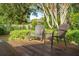 Inviting outdoor deck features cozy wicker chairs, perfect for relaxation and enjoying the lush surroundings at 3 Lauden Blvd, Isle of Palms, SC 29451