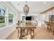 Open concept dining room features modern chandelier lighting and view of the adjacent living room at 3 Lauden Blvd, Isle of Palms, SC 29451