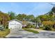 Bright home exterior featuring a multi-car driveway, garage, and well-maintained landscaping, offering curb appeal at 3 Lauden Blvd, Isle of Palms, SC 29451