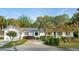 Charming one-story home with white exterior and well-manicured front yard landscaping at 3 Lauden Blvd, Isle of Palms, SC 29451