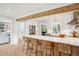 Spacious kitchen featuring a quartz countertop island with seating, white cabinets, and stainless steel appliances at 3 Lauden Blvd, Isle of Palms, SC 29451