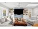 Bright living room with a large TV, skylights, ceiling fan and comfortable furnishings at 3 Lauden Blvd, Isle of Palms, SC 29451