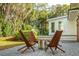 Charming outdoor patio features comfortable wooden chairs around a modern metal fire pit, creating an inviting ambiance at 3 Lauden Blvd, Isle of Palms, SC 29451