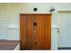 Outdoor wooden shower provides privacy and convenience, complemented by a classic exterior door at 3 Lauden Blvd, Isle of Palms, SC 29451