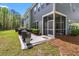 Charming backyard patio with seating, grill, and well-maintained landscaping at 3010 Emma Ln, Mount Pleasant, SC 29466