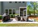 Backyard with a stone patio, grill, and comfortable seating area at 3010 Emma Ln, Mount Pleasant, SC 29466