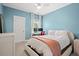 Comfortable bedroom features an accent wall, ceiling fan, and a window with natural light at 3010 Emma Ln, Mount Pleasant, SC 29466