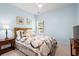 Relaxing bedroom featuring light blue walls and a cozy quilt at 3010 Emma Ln, Mount Pleasant, SC 29466