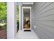 Front door entrance view looks into the townhome with hardwood floors, decor, staircase and furniture at 3010 Emma Ln, Mount Pleasant, SC 29466