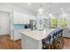 Modern kitchen with quartz countertops, stainless appliances, and barstool seating at the island at 3010 Emma Ln, Mount Pleasant, SC 29466