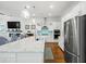 Spacious open kitchen with island seating, stainless appliances, and a modern aesthetic at 3010 Emma Ln, Mount Pleasant, SC 29466