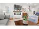 Bright living room with modern fireplace and mounted TV at 3010 Emma Ln, Mount Pleasant, SC 29466