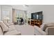 Bright living room with a desk, natural light, and comfortable sofas at 3010 Emma Ln, Mount Pleasant, SC 29466