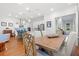 Spacious living space that flows into kitchen with pendant lighting and breakfast bar, and dining area with table at 3010 Emma Ln, Mount Pleasant, SC 29466