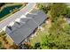 Aerial view showing townhome rear exteriors with patios, outdoor seating, and manicured lawns backing to a roadway at 3010 Emma Ln, Mount Pleasant, SC 29466
