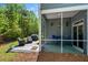 Relaxing screened porch with outdoor seating and view of the lush backyard at 3010 Emma Ln, Mount Pleasant, SC 29466