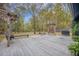 Expansive backyard deck with swings, benches, and a grill, ideal for outdoor gatherings and relaxation at 306 Teakwood Dr, Walterboro, SC 29488