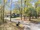 Charming two-story home with mature trees, lovely landscaping, and a long driveway at 306 Teakwood Dr, Walterboro, SC 29488