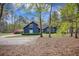 Charming exterior view of a well-maintained home with a lush yard and mature trees at 306 Teakwood Dr, Walterboro, SC 29488