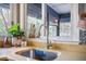 Close up of a sink with natural light and plants on the window sill at 306 Teakwood Dr, Walterboro, SC 29488