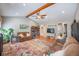 A cozy living room featuring laminate flooring, a vaulted ceiling, comfortable furniture, and charming decor at 306 Teakwood Dr, Walterboro, SC 29488