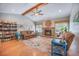 Inviting living room featuring hardwood floors, vaulted ceiling, fireplace, and ample natural light at 306 Teakwood Dr, Walterboro, SC 29488