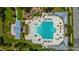 Aerial view of community pool with winding design, pool house, lounge chairs and splash pad at 3466 Yarmouth Dr, Mount Pleasant, SC 29466