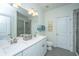 Bright bathroom with double sink vanity, white cabinets and framed mirror at 3466 Yarmouth Dr, Mount Pleasant, SC 29466