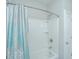 Bathtub with shower featuring white surround and a gray and teal floral shower curtain at 3466 Yarmouth Dr, Mount Pleasant, SC 29466