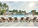 Resort-style pool with lounge chairs, splash features, and shaded areas, perfect for relaxation and recreation at 3466 Yarmouth Dr, Mount Pleasant, SC 29466