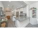 Charming kitchen with gray wood-look floors, white cabinets, granite countertops and stainless steel appliances at 3466 Yarmouth Dr, Mount Pleasant, SC 29466