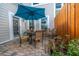 Back patio with paver flooring and a table and chairs under a blue umbrella at 3466 Yarmouth Dr, Mount Pleasant, SC 29466