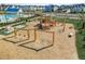Community playground includes slides, swings, climbing structures and seating surrounded by green space and a pool at 3466 Yarmouth Dr, Mount Pleasant, SC 29466