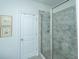 Tiled shower with glass doors and chrome showerhead at 3466 Yarmouth Dr, Mount Pleasant, SC 29466
