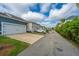 Street view showing townhomes with driveways and garages on a sunny day at 3466 Yarmouth Dr, Mount Pleasant, SC 29466