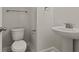Half bath with pedestal sink, toilet, and updated fixtures at 347 Wappoo Trace Ln, Summerville, SC 29486