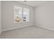 Cozy bedroom with neutral carpet and white walls, illuminated by natural light at 347 Wappoo Trace Ln, Summerville, SC 29486