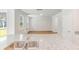 Island with granite countertop and stainless sink overlooking spacious room with hardwood floors and natural light at 348 Dickerson Ln, Lincolnville, SC 29485