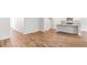 Spacious, open-concept living room with hardwood floors, a kitchen and white trim throughout at 348 Dickerson Ln, Lincolnville, SC 29485