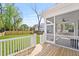 Inviting screened back porch, overlooking a well maintained lawn and fenced backyard, perfect for relaxation and outdoor enjoyment at 4155 Jean Laffite Rd, Hollywood, SC 29449