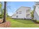 Spacious backyard with lush green lawn and partial view of the house exterior at 4155 Jean Laffite Rd, Hollywood, SC 29449