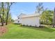 Spacious backyard with lush green lawn and partial view of the house exterior at 4155 Jean Laffite Rd, Hollywood, SC 29449