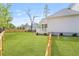 Well-maintained backyard featuring a wooden fence, grassy area, and partial view of the house at 4155 Jean Laffite Rd, Hollywood, SC 29449